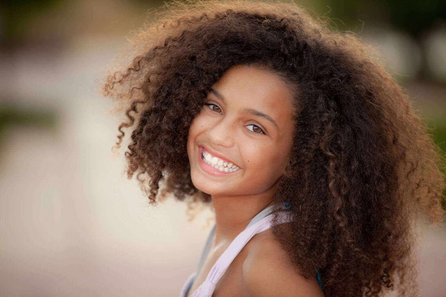 young biracial girl with curly hair